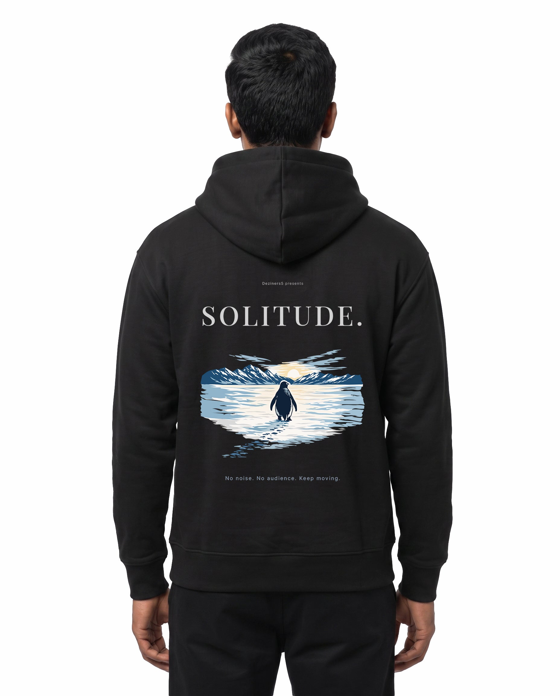 Back view of male model wearing SOLITUDE - unisex regular-fit hoodie in black in a studio setting.