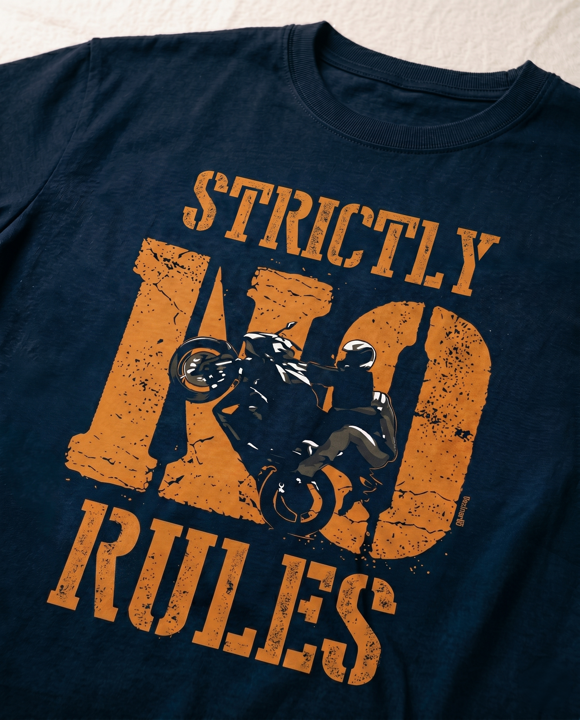 Detailed close-up of the STRICTLY NO RULES graphic print highlighting typography and premium print quality on a navy blue men's regular-fit t-shirt.
