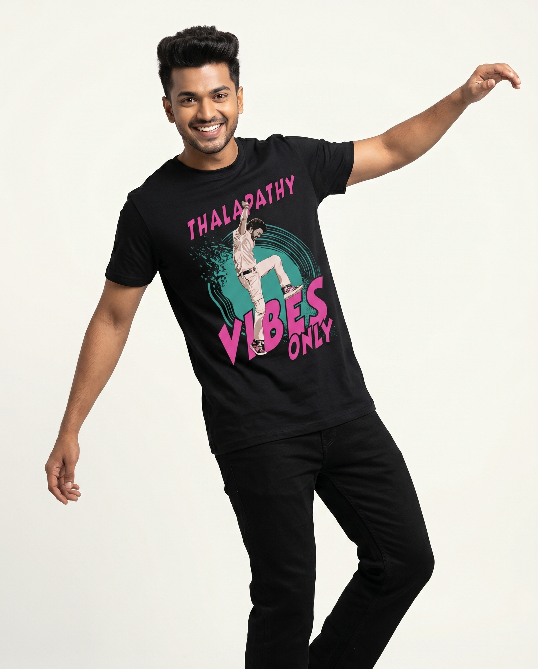 Young South Indian male wearing THALAPATHY VIBES men's regular-fit t-shirt in black in premium studio fashion portrait.