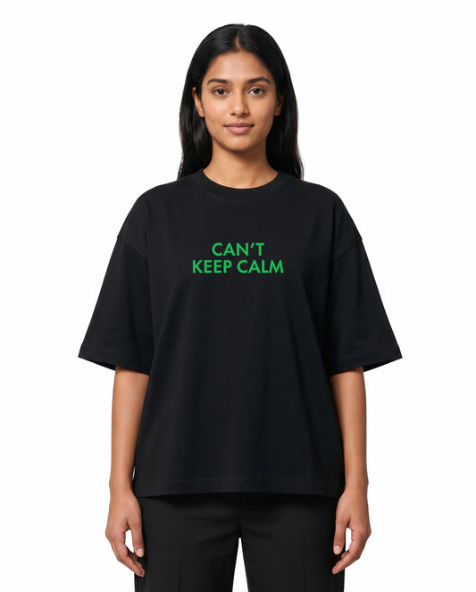 Front view of female model wearing THE ARR TRACK - HINDI - Unisex Oversized Graphic T-Shirt in black in a studio setting.