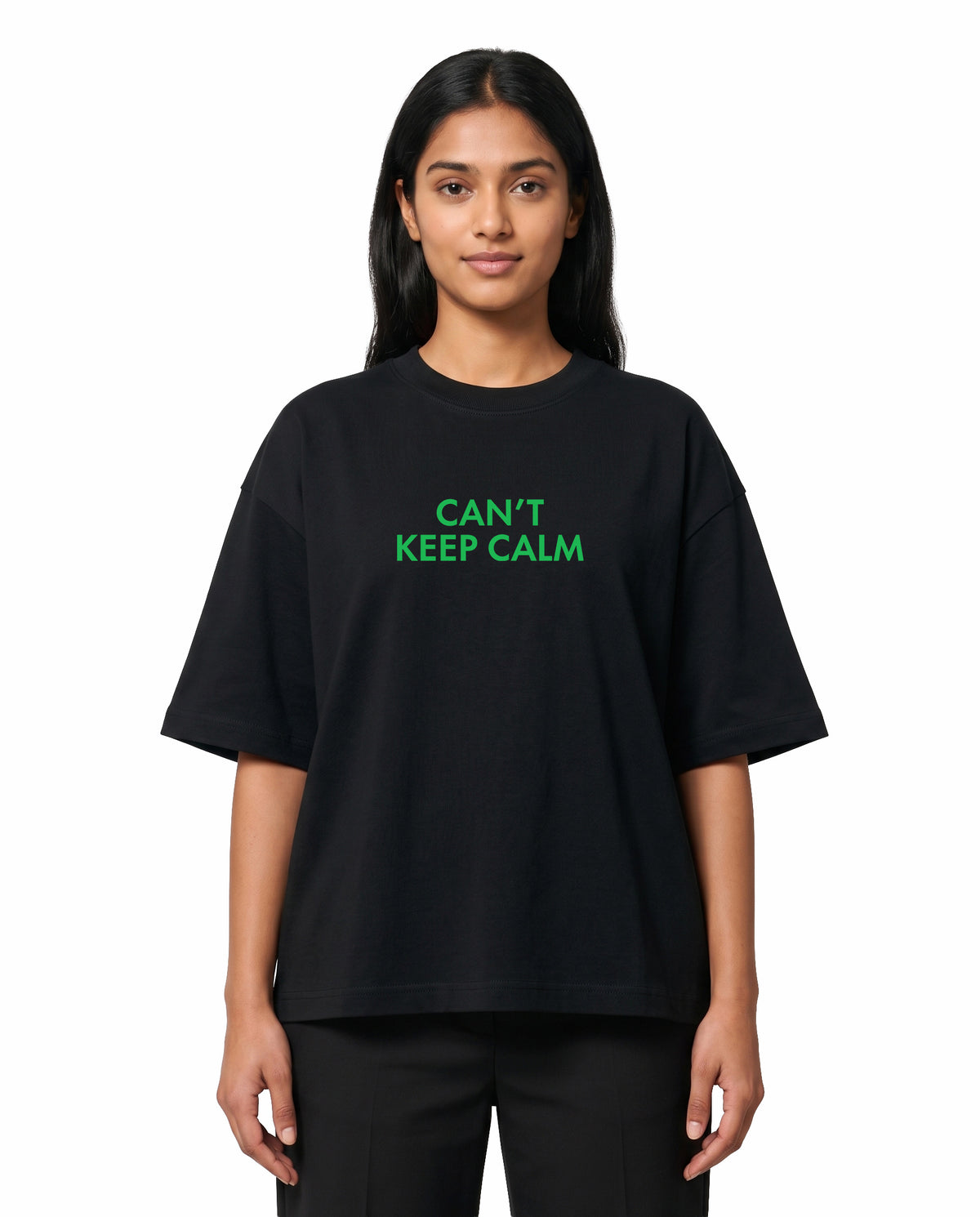Front view of female model wearing THE ARR TRACK - TAMIZH - Unisex Oversized Graphic T-Shirt in black in a studio setting.