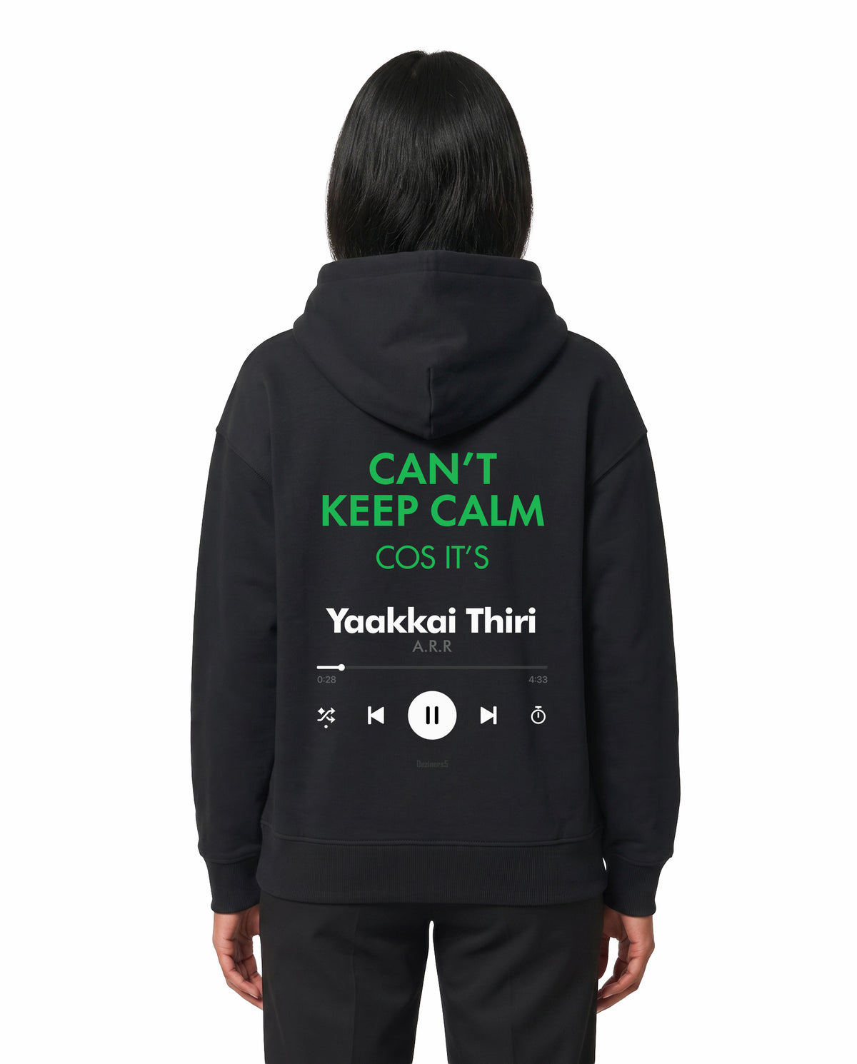 Back view of female model wearing THE ARR TRACK - TAMIZH - Unisex Regular Fit Hoodie in black in a studio setting.