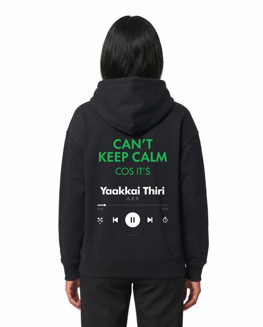 Back view of female model wearing THE ARR TRACK - TAMIZH - Unisex Regular Fit Hoodie in black in a studio setting.