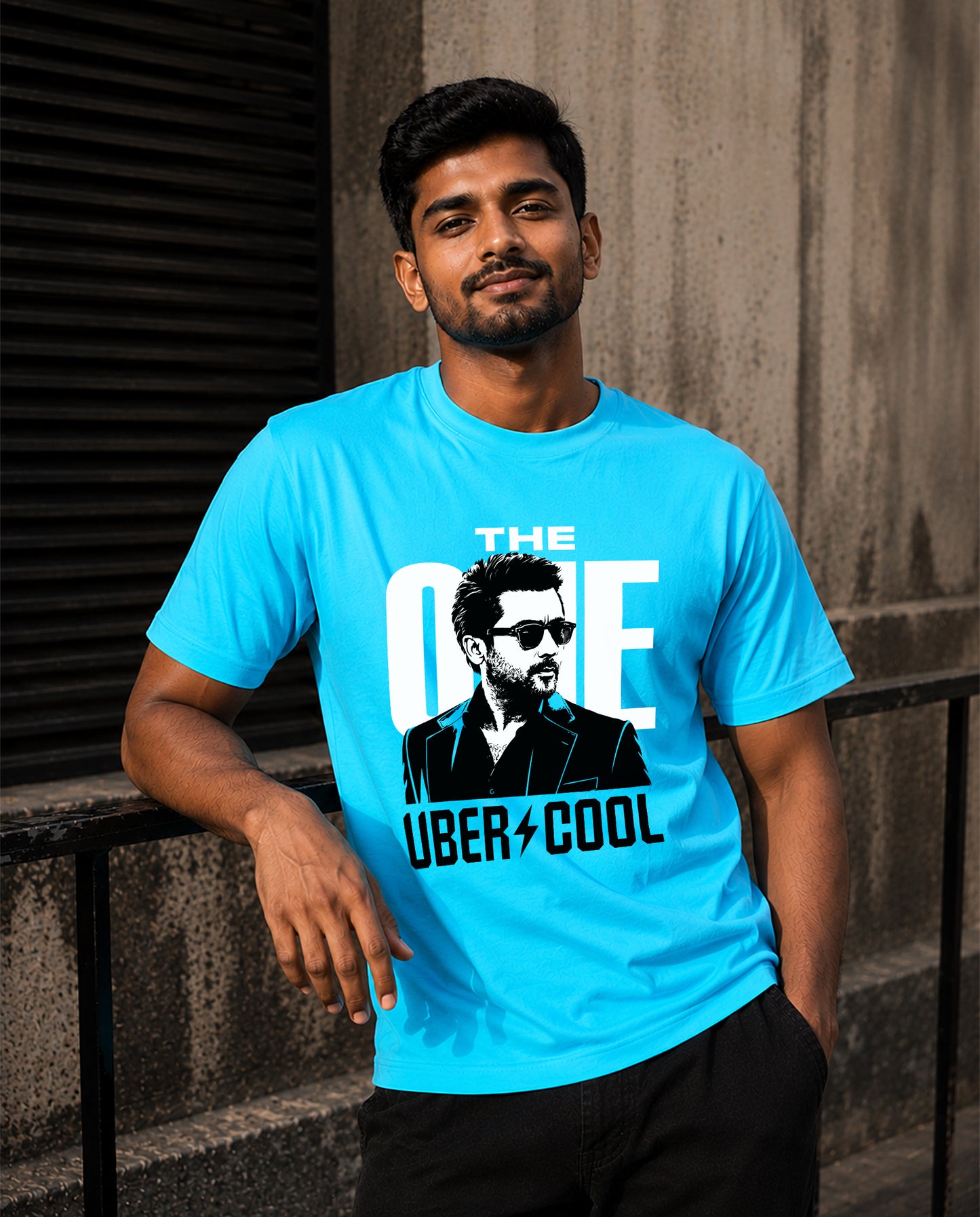 Front view of man wearing THE ONE men's regular-fit t-shirt in sky blue in a lifestyle setting.