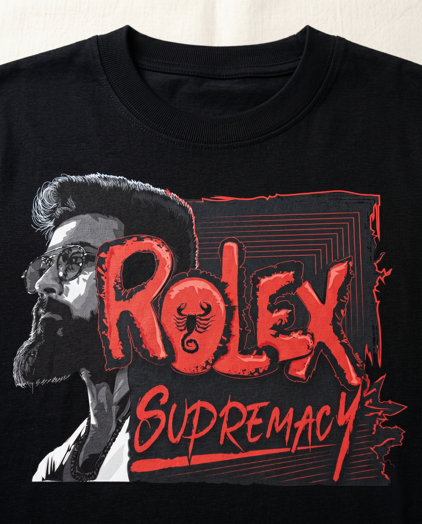 Detailed close-up of the THE ONE SUPREMACY graphic print highlighting typography and premium print quality on a black men's regular-fit t-shirt.