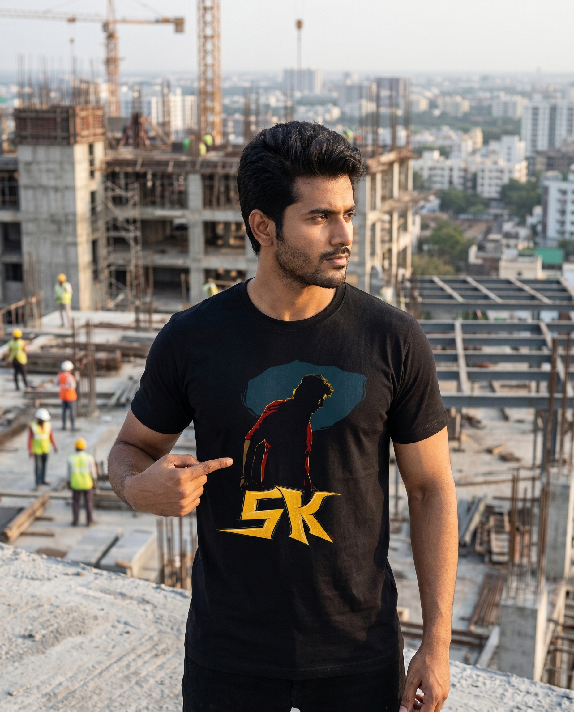 Young South Indian male wearing THE RISE OF SK men's regular-fit t-shirt in black in an inspirational urban rooftop setting.
