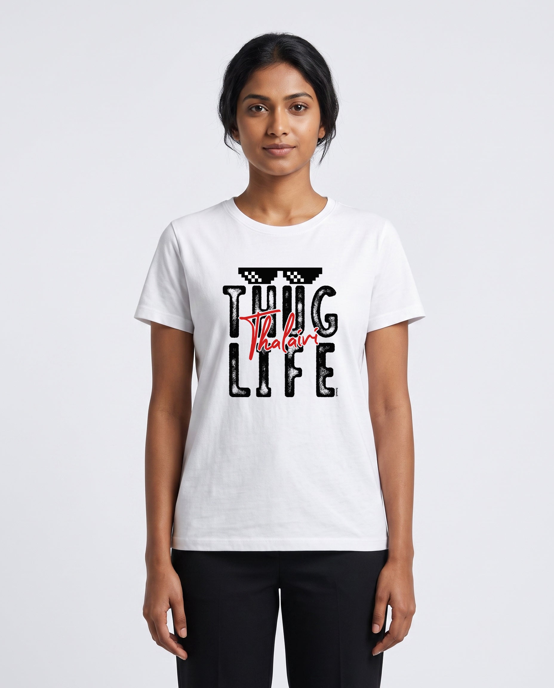 Female model wearing THUG LIFE THALAIVI women's regular-fit t-shirt in white in a studio setting.