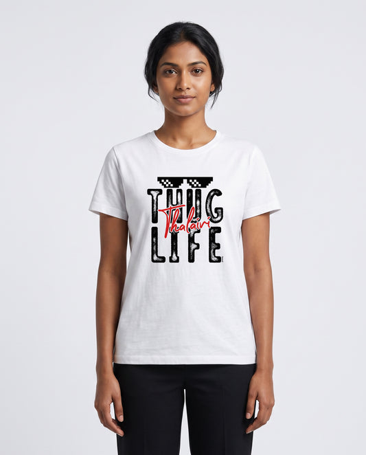 Female model wearing THUG LIFE THALAIVI women's regular-fit t-shirt in white in a studio setting.