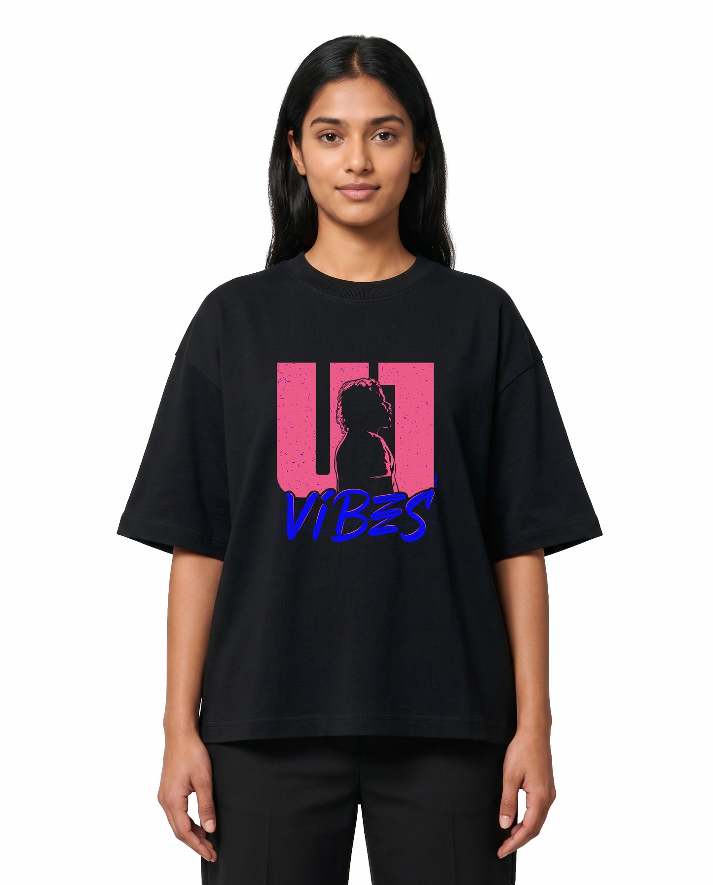 Front view of female model wearing U1 VIBES unisex oversized graphic t-shirt in black in a studio setting.