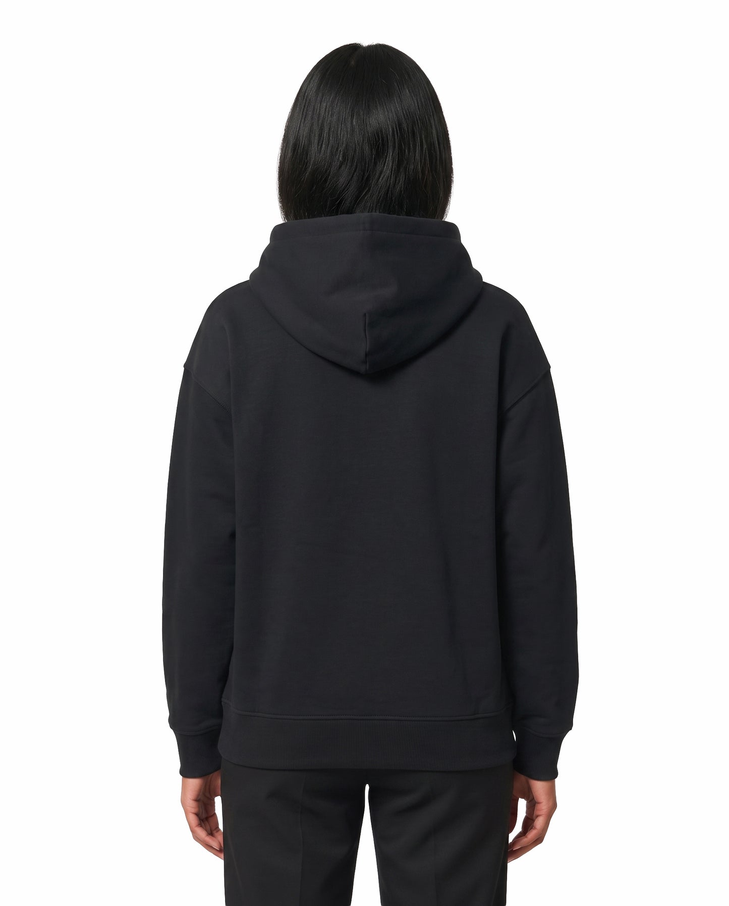 Back view of female model wearing U1 VIBES - unisex regular-fit hoodie in black in a studio setting.