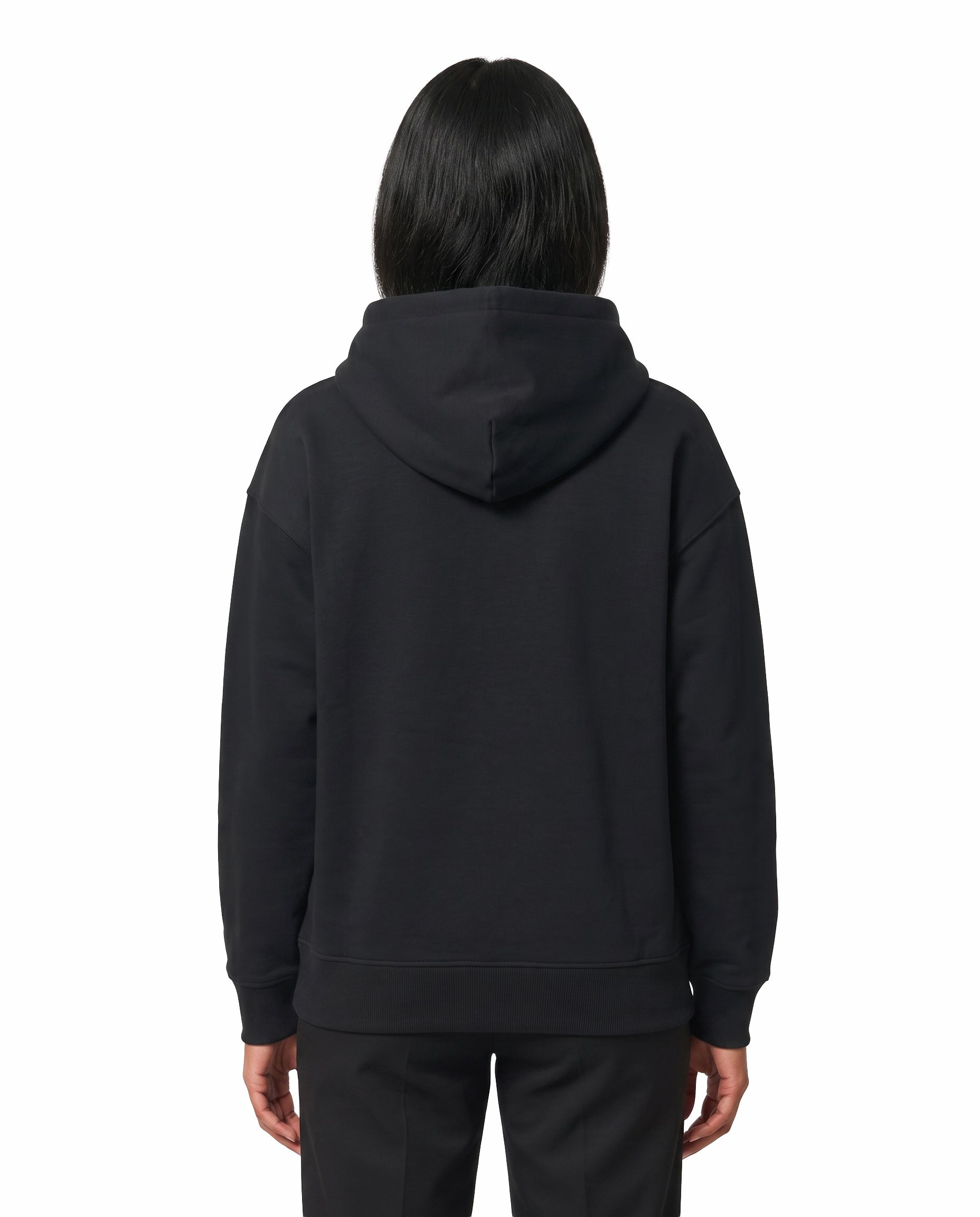 Back view of female model wearing U1 VIBES - unisex regular-fit hoodie in black in a studio setting.