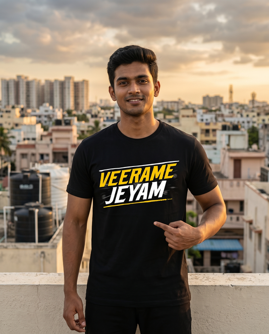 Young South Indian male wearing the VEERAME JEYAM men's regular-fit t-shirt in black in a heroic urban lifestyle setting.