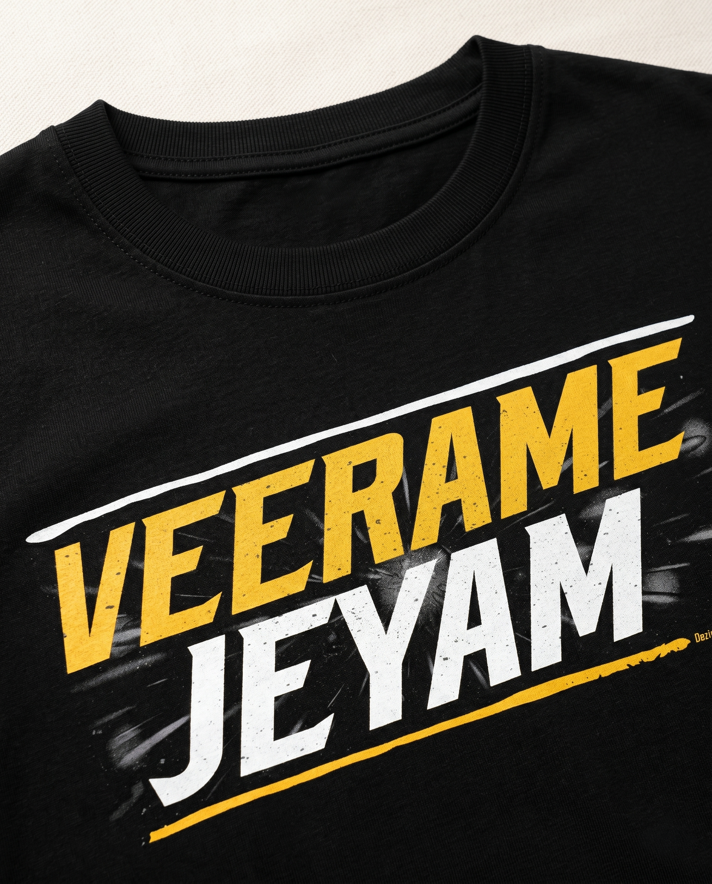Detailed close-up of the VEERAME JEYAM typography print showcasing premium print quality and design details on a black men's regular-fit t-shirt.