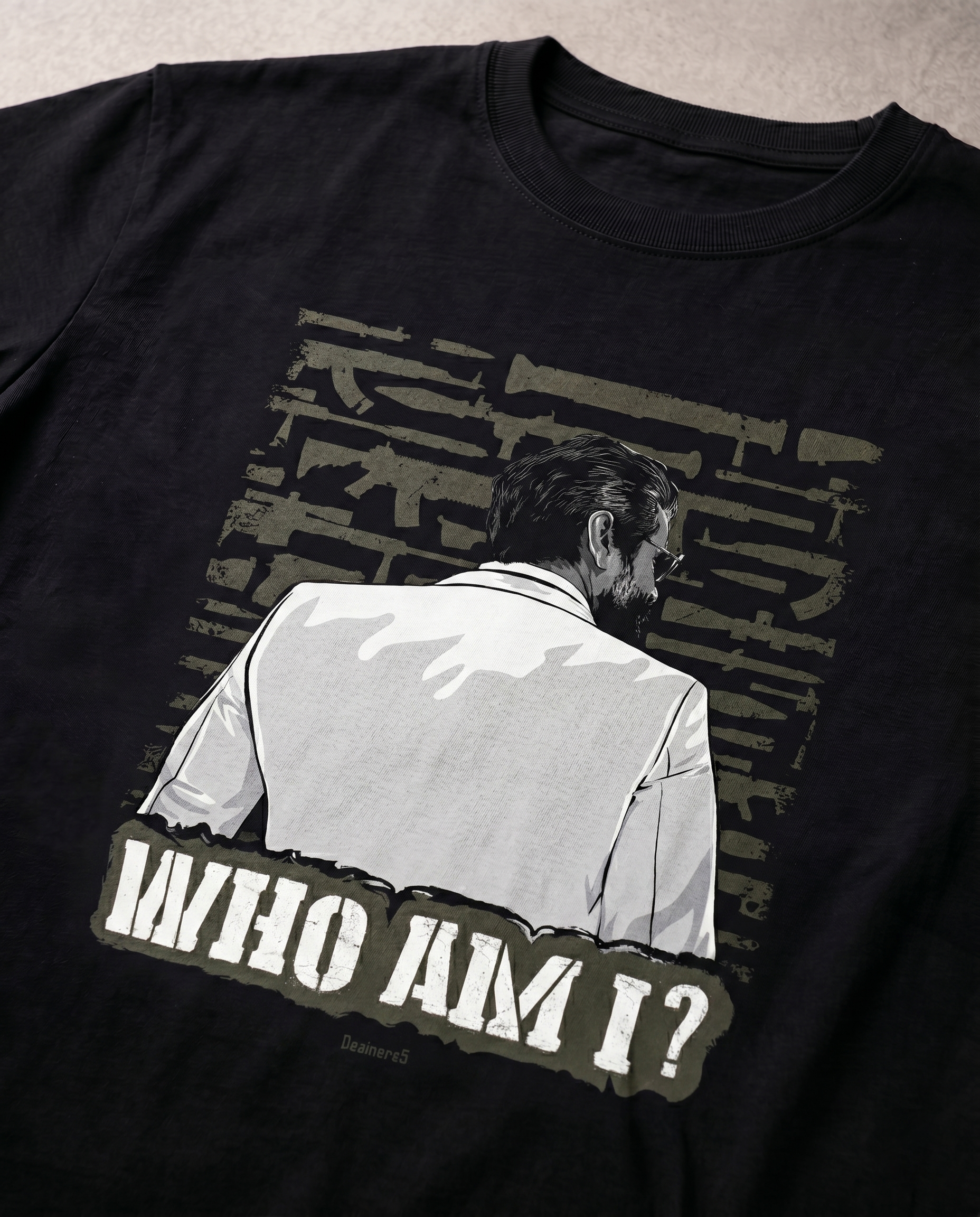 Detailed close-up of the WHO AM I illustrated graphic print highlighting premium print quality and artwork details on a black men's regular-fit t-shirt.